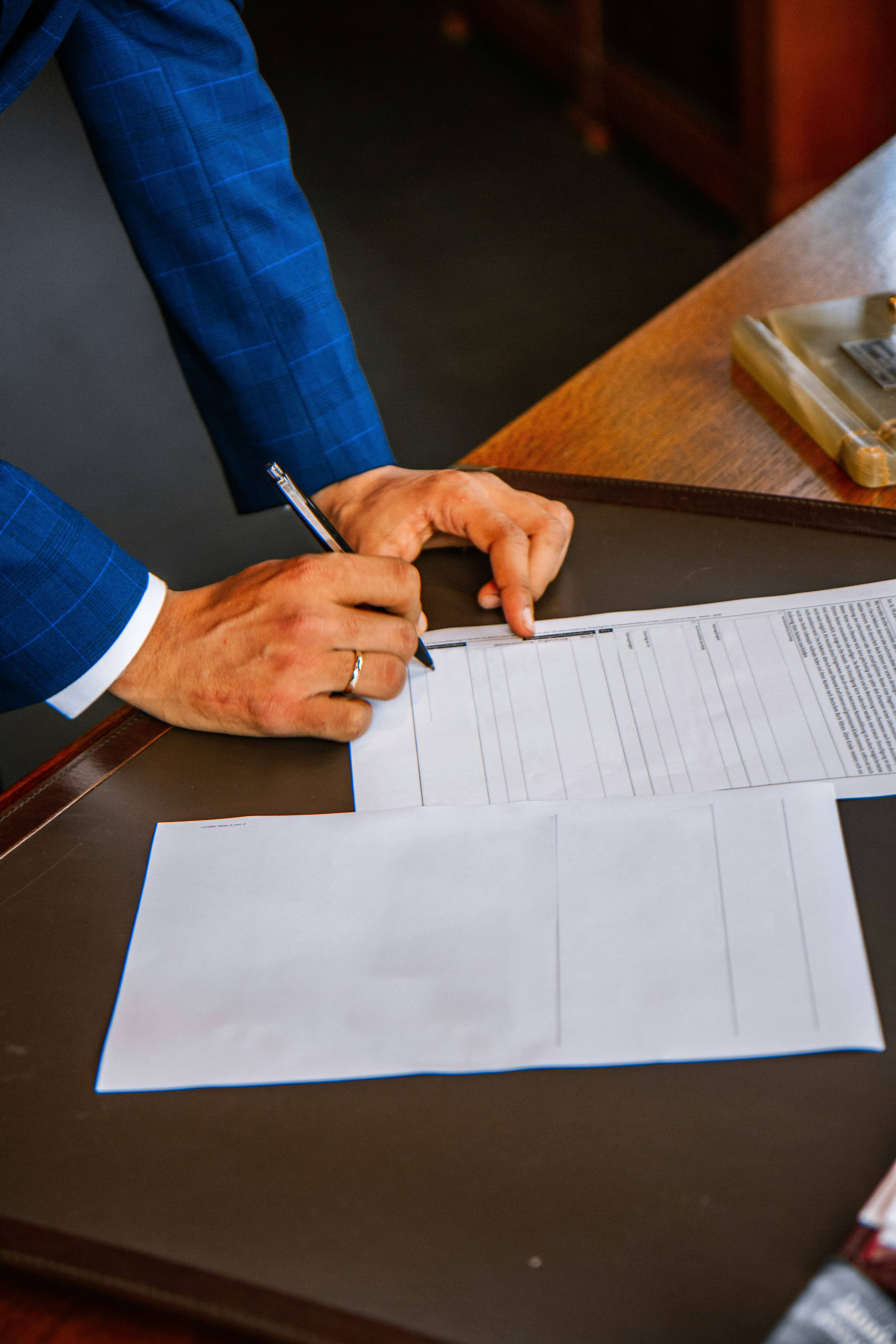 Signing property documents at a desk