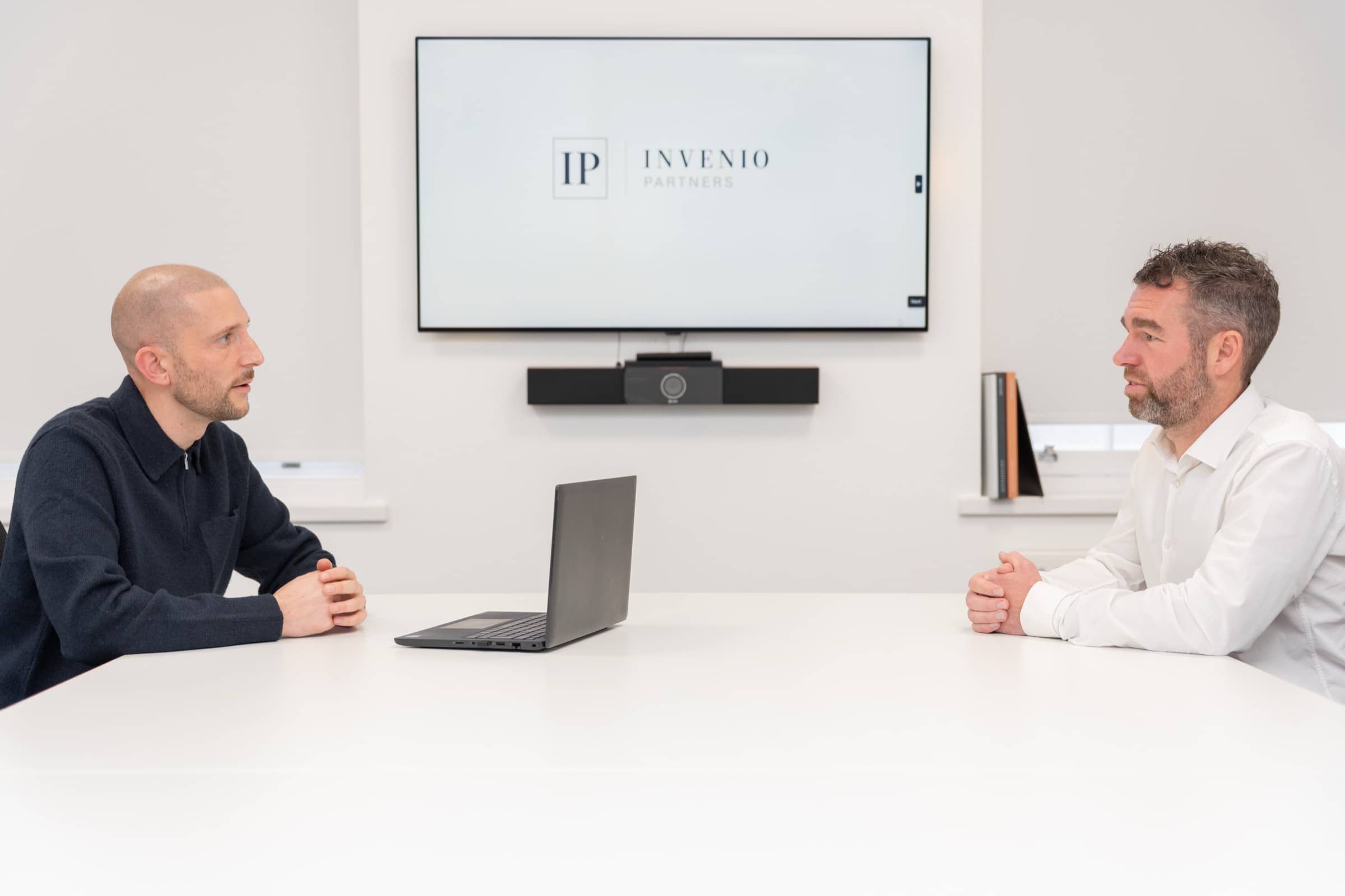 Matt Iles meeting a client across a boardroom table
