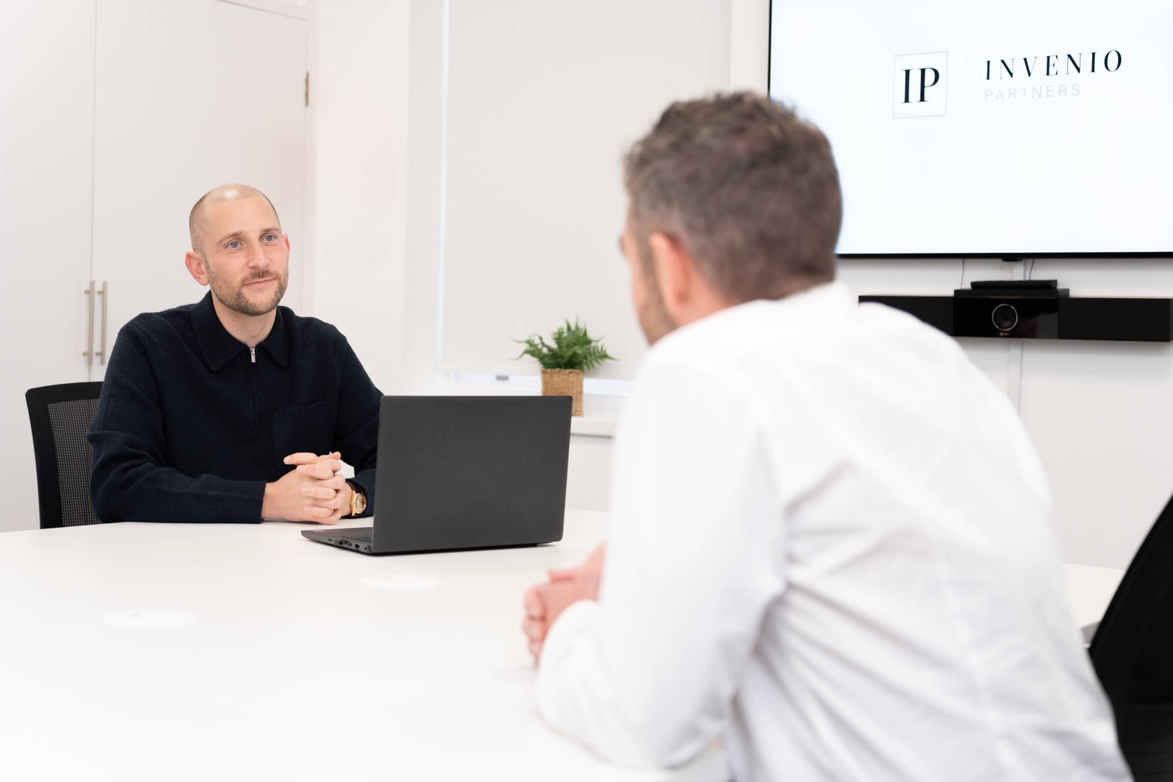 Matt Iles in a meeting at the Invenio Partners office